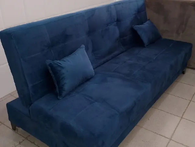 Sofá-cama azul com almofadas - Holanda Móveis, Praia Grande